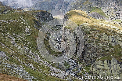 Mountain river canyon near Cascata delle Pisse waterfall in valley of Pisse, Alagna Valsesia area Stock Photo