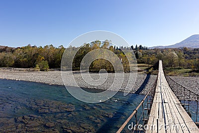 Mountain riverbed slow smooth flow of water on a Sunny day a place for walking and relaxing. Stock Photo