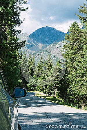 Mountain road in the Alps. Car parked by the road. Brusson, Italy Stock Photo