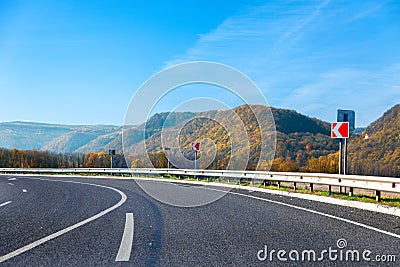 Mountain road bright autumn day with blue sky Stock Photo