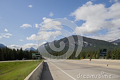 Highway in mountains Trans Canada Highway with a perfect asphalt at sunrise in summer. in Banff National Park, Alberta, Canada. Editorial Stock Photo