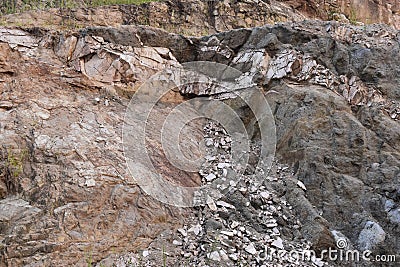 Mountain rock cross section in asia region various minerals. Stock Photo