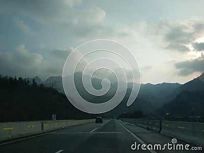 Mountain scenery cyan sun road Stock Photo