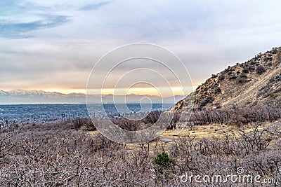 Mountain and sea with beautiful background of overcast sky and golden sunset Stock Photo