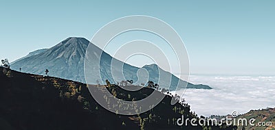 Mountain sindoro and sumbing landscape over the cloud wallpaper edited photo Stock Photo