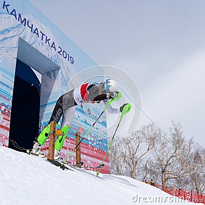 Mountain skier at start skiing down. Russian Alpine Skiing Championship, slalom Editorial Stock Photo