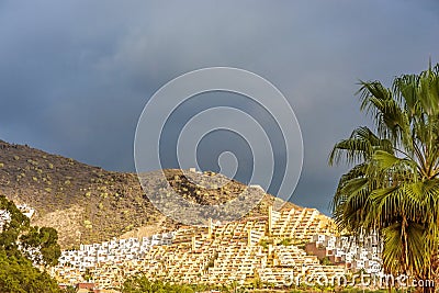 Heavily built mountain slope full of apartment complexes Stock Photo
