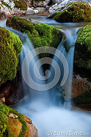A mountain stream waterfall. Stock Photo