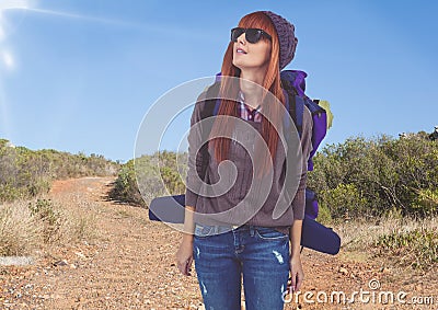 mountain travel,woman mountaineer with sun glasses in the road Stock Photo