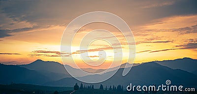 Radiant Awakening: Captivating Summer Sunrise in a Majestic Mountain Valley Stock Photo