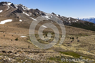 Mountain view with rock, trees and snow Stock Photo