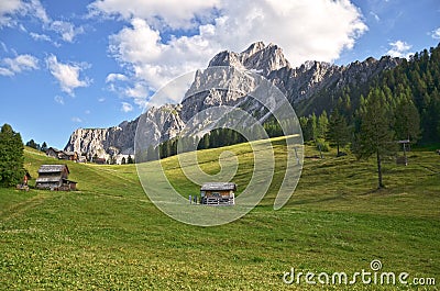 Mountain view: Rugged rocks green meadows. Stock Photo