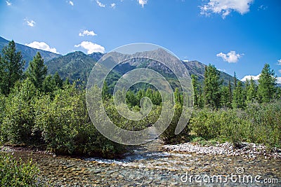 Mountain view with small river in front, sunny summer day. East Sayan, Buryatia, Russia. Stock Photo