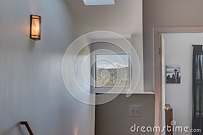 Mountain view through window over stairway entry and Seattle Editorial Stock Photo