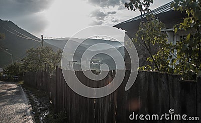 Mountain village, house and fence, view of the valley Stock Photo