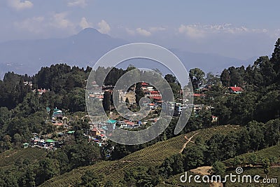 mountain village and terrace farming on slopes of himalayan foothills near darjeeling hill station Stock Photo