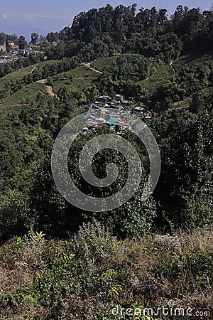 mountain village and terrace farming on slopes of himalayan foothills near darjeeling hill station Stock Photo