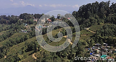 mountain village and terrace farming on slopes of himalayan foothills near darjeeling hill station Stock Photo