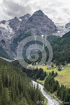 Mountain Village by the River and Forest Stock Photo