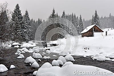 Mountain wooden chalet covered with fresh snow Stock Photo