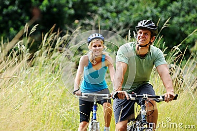 Mountainbike couple outdoors Stock Photo