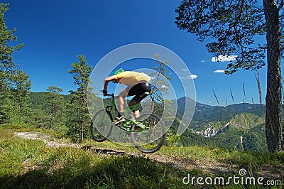 Mountainbikers jump Stock Photo