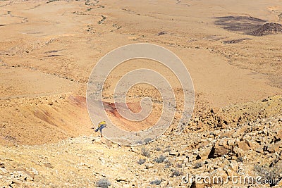 Mountaineer man tourist backpacker posing yoga desert mountain s Stock Photo