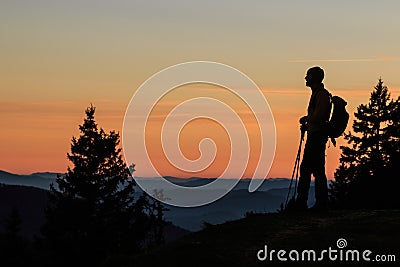 Mountaineer silhouette at the sunset Stock Photo