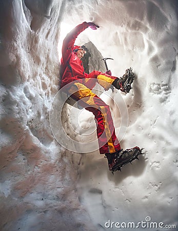 Mountaineer in snow cave Stock Photo