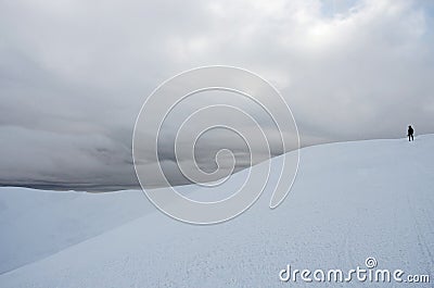 Mountaineer standing on top of Gimba mountain during winter snow Stock Photo