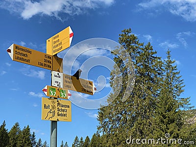 Mountaineering signposts and markings on peaks and slopes of the Pilatus mountain range and in the Emmental Alps, Alpnach Editorial Stock Photo