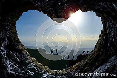 Mountaineers through heart shaped rock formation Stock Photo