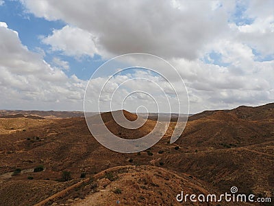 Mountainous part of the Sahara desert surrounding the city of Matmata, Tunisia Stock Photo