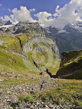 Mountains, clouds and blue sky. Kandersteg - Oeschinensee. Berner Oberland. Switzerland Stock Photo