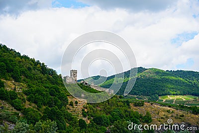 Mountains on Danube beach and castle ruins. Stock Photo