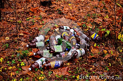 Mountains and garbage plastic bottles of beer and drinks, people throw on the road. Editorial Stock Photo