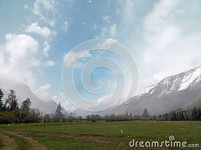Snowy Altai mountains against the blue sky Stock Photo