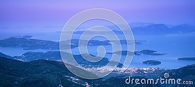 Mountains, islands and city on the sea cost at night Stock Photo