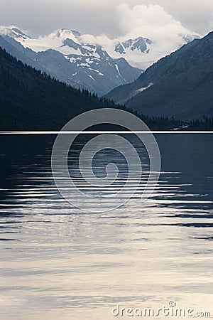 Mountains, lake and reflection. Stock Photo