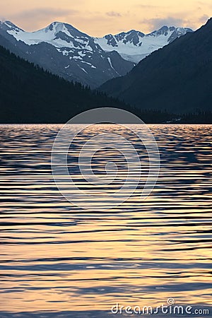 Mountains, lake and ripples. Stock Photo