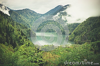 Mountains landscape with a lake view. Caucasus. Lake Ritza Stock Photo