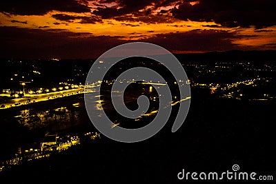 Serene Sunset: Mountains and Village Silhouettes in Nakornnayok, Thailand Stock Photo