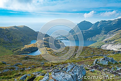 Mountains of Lofoten Island on a sunny arctic day. View from trail to Hermannsdalstinden peak. Hiking mountains of Lofoten, Norway Stock Photo