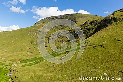 Mountains by Moss Force waterfall Lake District National Park Cumbria uk on a beautiful blue sky summer day Stock Photo