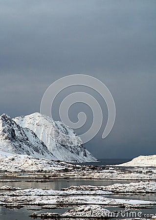 Mountains peaks rise to the sky of Lofoten islands of Norway.The beautiful islands from a ferry point of view Stock Photo