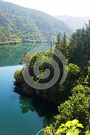 Mountains river with steep foresty banks Stock Photo