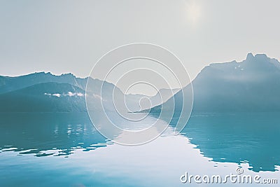 Mountains and sea mirror water reflection landscape Stock Photo