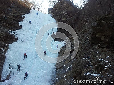 Ice climber climbing frozen water of kangchon waterfall Stock Photo