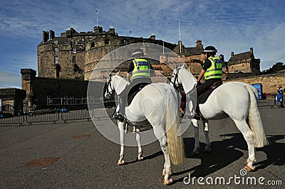 Mounted police at the Edinburgh Castle a historic fortress which dominates the skyline of Edinburgh, the capital city of Scotland Editorial Stock Photo