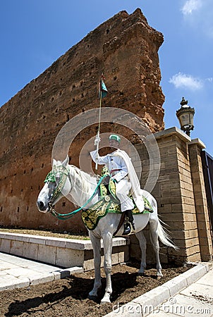 A mounted soldier at the 12th Century walled entrance to Hassan Tower in Rabat, Morocco. Editorial Stock Photo